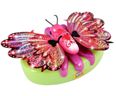 A pretty pink butterfly toy with sparkly wings.