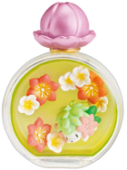 A little bottle with a pink, flower-shaped cap filled with white and orange flowers. The Pokemon Shaymin is inside.