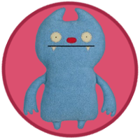 A blue monster with a big red nose and two fangs.