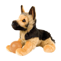 A german shepherd plush sitting with a ball.