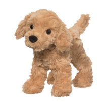 A fuzzy tan dog plush standing up.
