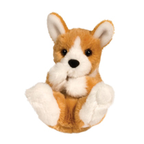 A cute plush corgi all curled up.