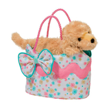 A puppy in a cute pink and white purse with bow on it.